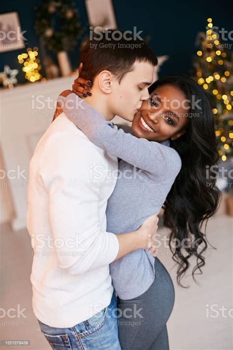 Black Man And White Girl - Beautiful Black Girl And White Guy Cuddling In The Living Room On
