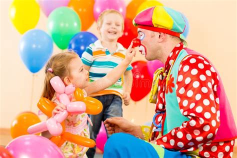 Happy Children With Clown On Birthday Party Stock Photo Image Of