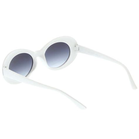 retro white oval sunglasses with tapered arms neutral colored gradient lens 50mm oval