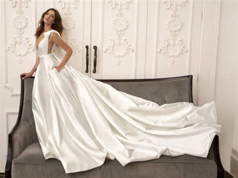 Mikado Wedding Gown With Pockets Plunging Neck And Dramatic