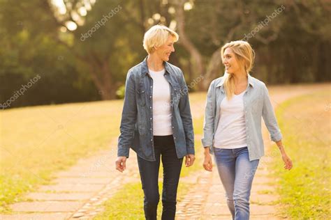 Mother And Daughter Walking Stock Photo By ©michaeljung 76413197