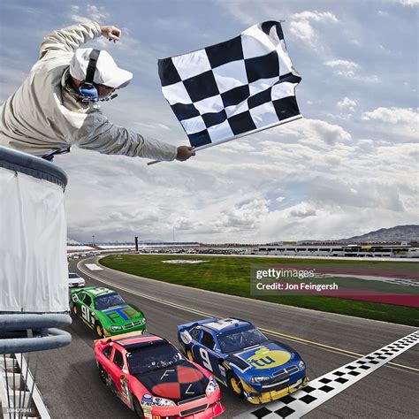 Race Car Crossing The Finish Line High Res Stock Photo Getty Images