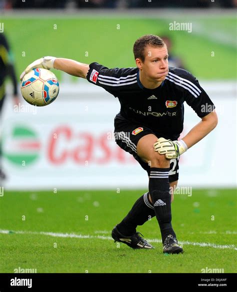 Leverkusens Goalkeeper Bernd Leno Throws The Ball During The