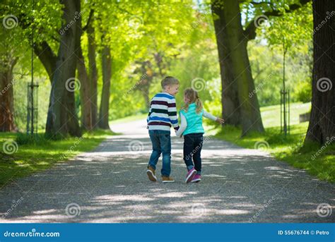 Two Happy Children Walking In Park Stock Photo Image Of Lifestyle