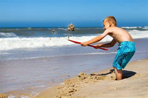 Boy Digging Hole In Sand Stock Photo Image Of Game Closeup 18970048