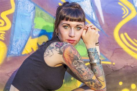 Rebel Girl Tattooed Against A Painted Wall With Graffiti Stock Image Image Of Cool Abandoned