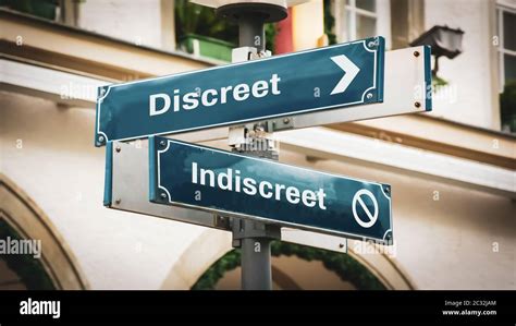 Street Sign Discreet Versus Indiscreet Stock Photo Alamy