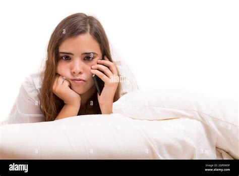 Depressed Woman Lying In Bed Isolated Over White Stock Photo Alamy