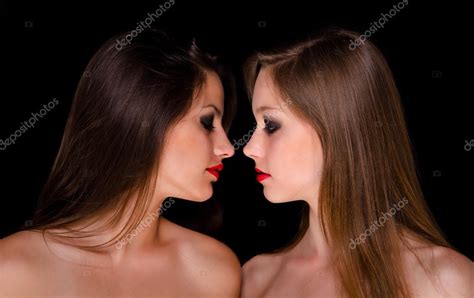 Profiles Of Two Beautiful Girls Being Intimate Stock Photo By Solidphotos