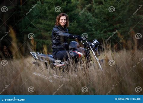 Woman On A Motorbike In Nature Biker Motorcycle Ride Through The Woods Stock Photo Image Of