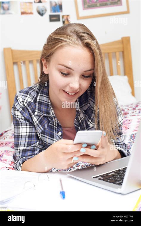 Attractive Teen Girl Using Mobile Hi Res Stock Photography And Images