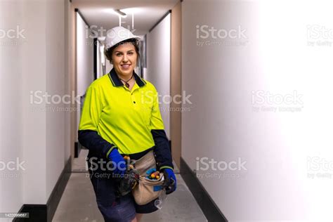 Portrait Of A Real Life Female Electrician At Work Stock Photo