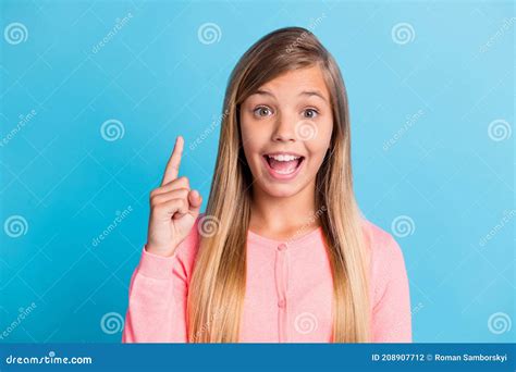 Photo Portrait Of Excited Girl Pointing Finger Up Isolated On Pastel