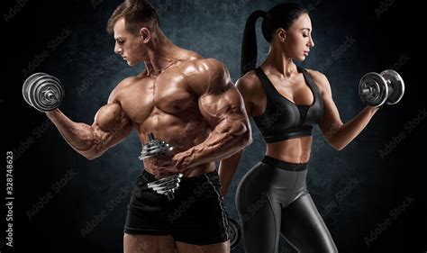 Sporty Couple Workout With Dumbbells Muscular Man And Woman Showing