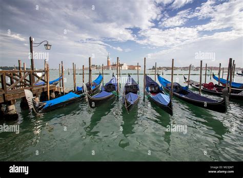 Gondolas At Saint Marks Square With View Of San Giorgio Maggiore