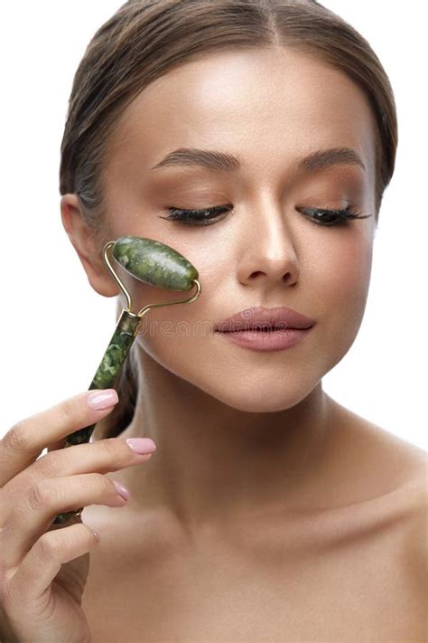 Beauty Skin Care Woman Using Jade Facial Roller For Face Massage Stock Image Image Of