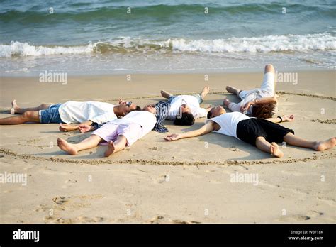 Group Of Friends Having Fun On The Beach Hi Res Stock Photography And