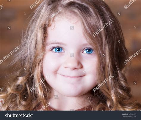 Beautiful Little Curly Blonde Girl Has Stock Photo 345161459 Shutterstock