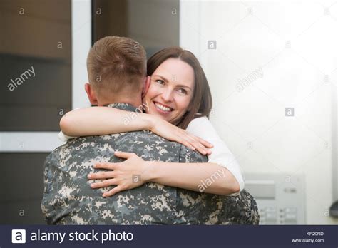 Happy Wife Hugging Her Husband Stock Photo Alamy