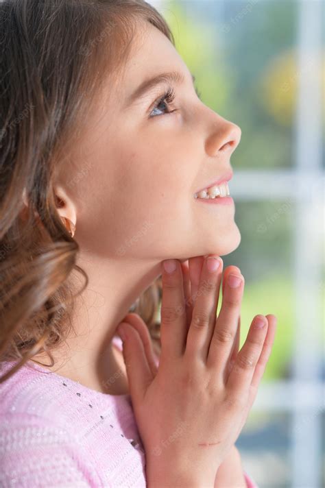 Premium Photo Portrait Of A Cute Little Girl Praying At Home