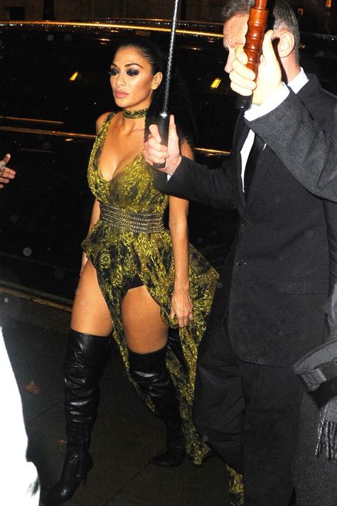 Nicole Scherzinger Flashes Pert Boobs In Plunging Peacock Dress With Thigh High Leather Boots