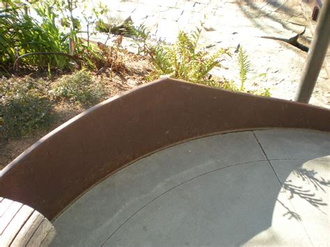 As with any retaining wall, you must provide adequate anchorage and drainage to prevent the wall's movement. Curvlinear steel retaining wall - IMK