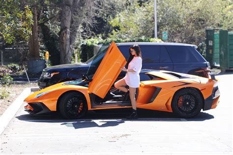 Kylie Jenner Stepping Out Of Her Orange Lamborghini Aventador Roadster Los Angeles 0311 2017