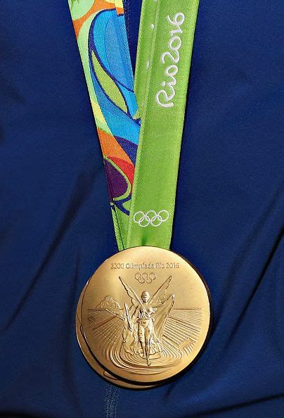 A View Of A Rio 2016 Olympic Gold Medal As Olympic Athletes Conor Dwyer And Maya Olympic Gold
