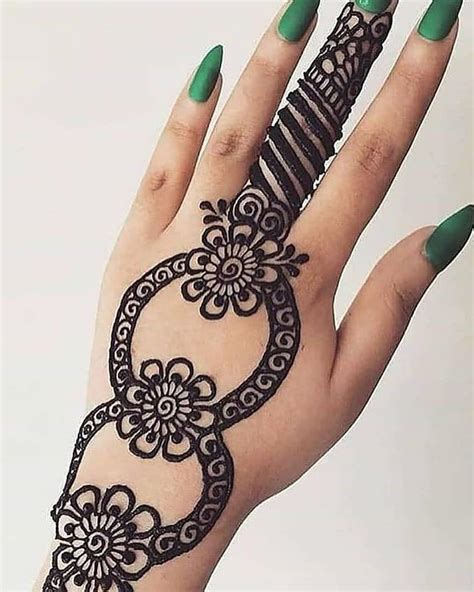 One Finger Black Henna Floral Design Henna Tattoo Designs Mehandi Designs Henna Hand Tattoo