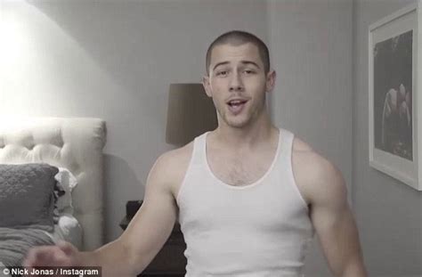 nick jonas flaunts his muscly biceps to announce new single levels daily mail online