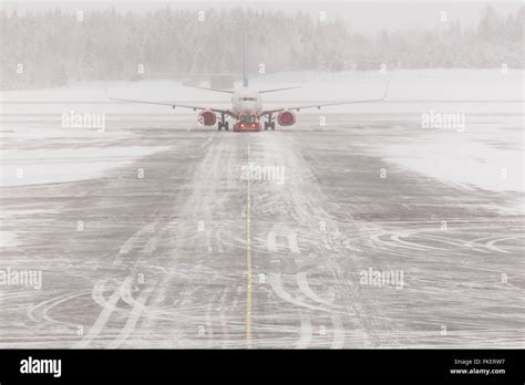 Snow On The Runway With Airplane