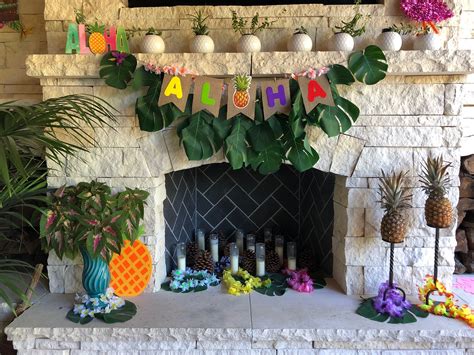 Aloha luau decor by the fireplace, Hawaiian summer house party decor