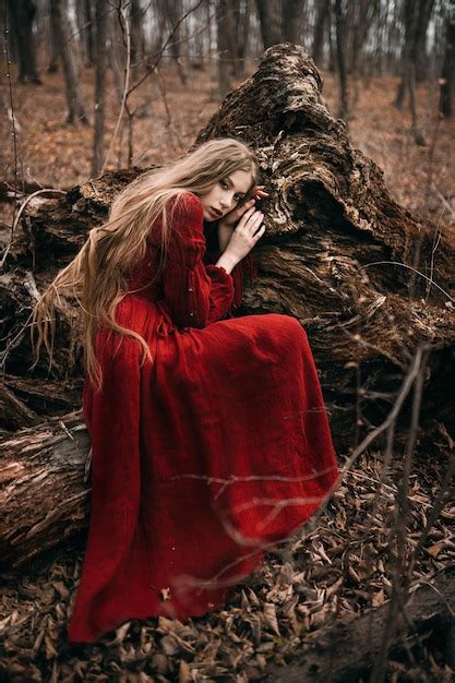 Premium Photo Young Witch In The Autumn Forest