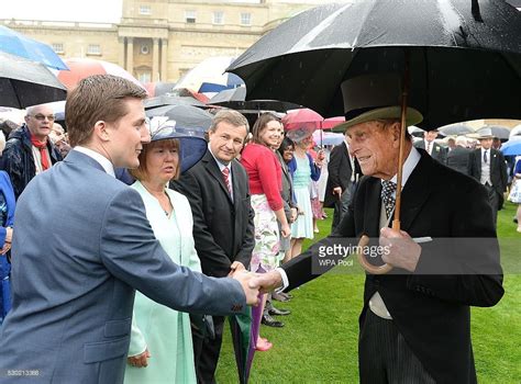 Prince Philip Duke Of Edinburgh Shelters From The Rain Under An Royal Garden Party Prince