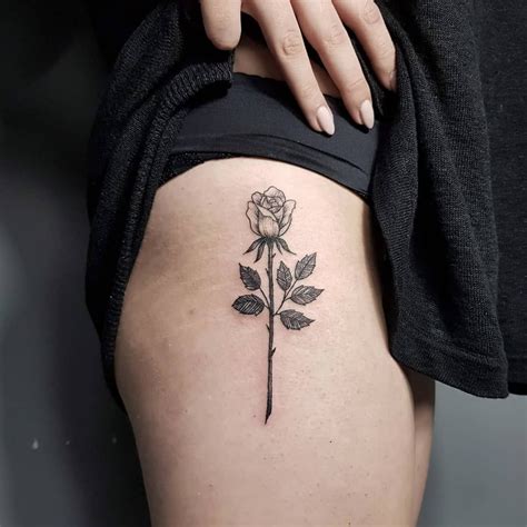 Red and grey create a powerful combination when worn together. Black and grey rose tattoo on the right hip by Tattoo Wizard | Neck tattoo, Tattoos, Red tattoos