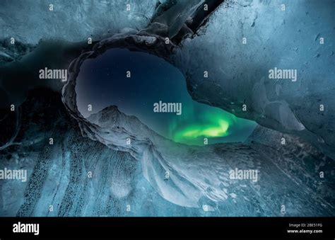 Northern Lights Aurora Borealis Over Glacier Ice Cave Stock Photo Alamy