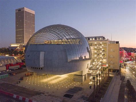 An Aerial View Of A Large Building With A Dome Like Structure In Front