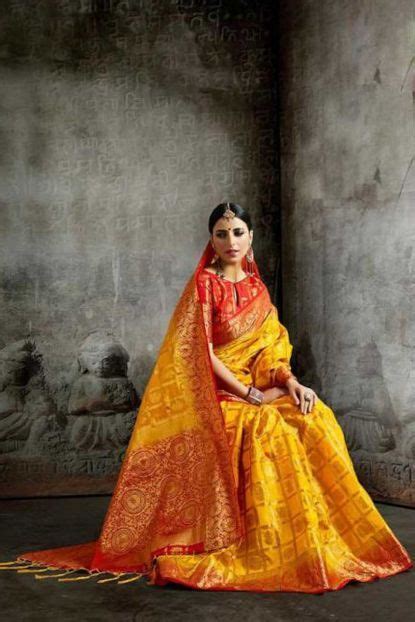 Yellow Gujarati Patola Style Weaved Silk Saree With Blouse Piece