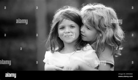 Little Boy And Girl Best Friends Hugging Kids Kissing Each Other With