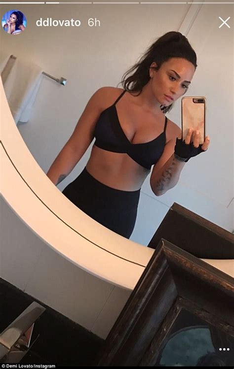 Demi Lovato Flashes Cleavage And Gym Honed Waist Daily Mail Online