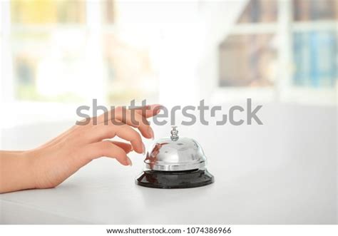 Young Woman Ringing Service Bell Reception Photo De Stock Modifiable
