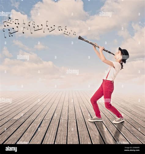 Little Girl Playing Clarinet On A Wharf Stock Photo Alamy