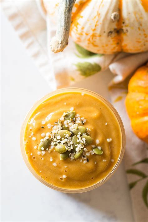 Creamy Textured Healthy Pumpkin Smoothie Topped With Pumpkin Seeds And