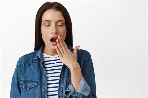 Free Photo Close Up Of Tired Adult Woman Yawning Close Eyes And