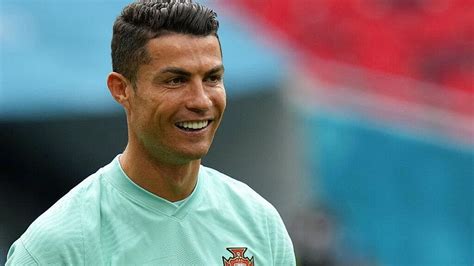 Smiley Cristiano Ronaldo Cr7 Is Wearing Sports Dress Standing In Blur
