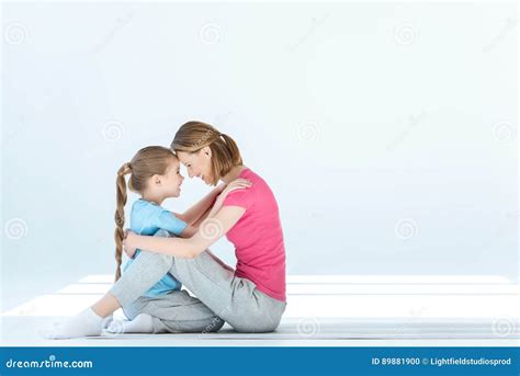 Daughter And Mother Hugging Each Other On White Stock Photo Image Of