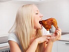 Woman eating chicken stock image. Image of happiness - 18368319