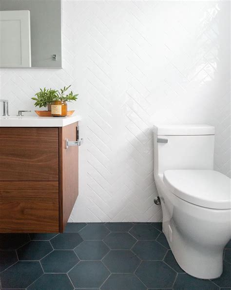 These are also extremely simple to clean, which allows users to maintain their luxurious looks without a hassle. Large grey hex floor tile and white herringbone wall tile ...