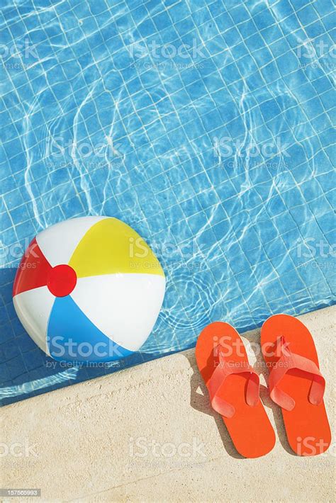 Swimming Pool Summer Fun With Floating Beach Ball Flip Flops Stock