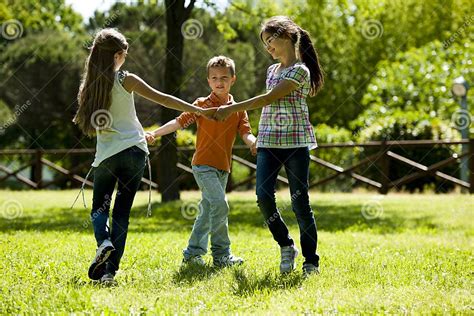 Children Playing Ring Around The Rosy Stock Image Image Of Caucasian
